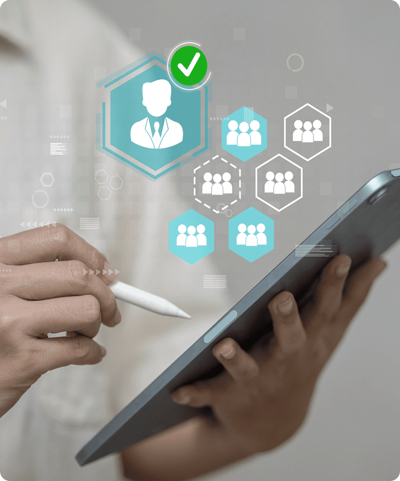 Person using tablet with digital icons overlay.